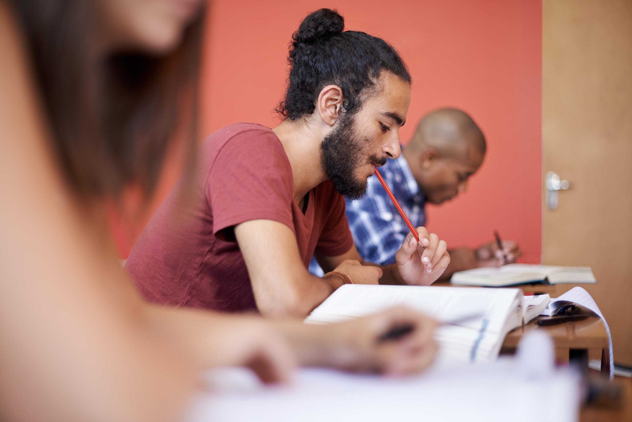 man taking exam in classroom